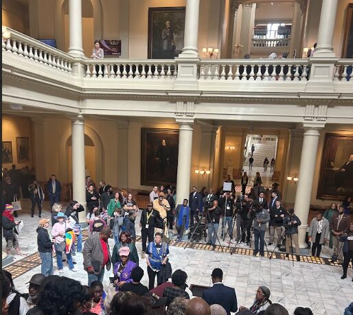 Supporters of civil rights bills line up on the stairs in the Capitol while civic leaders hold a press conference below